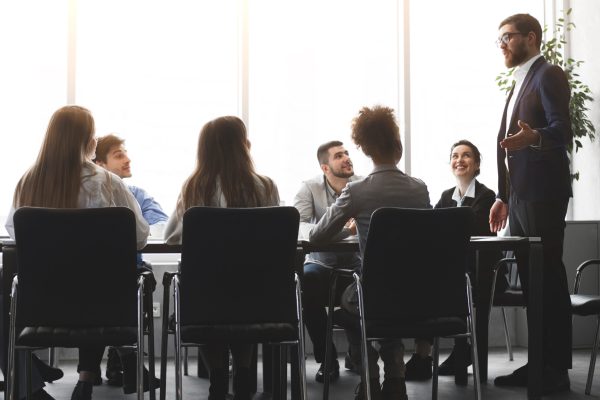 CEO presenting lecture in the boardroom office workplace to colleagues
